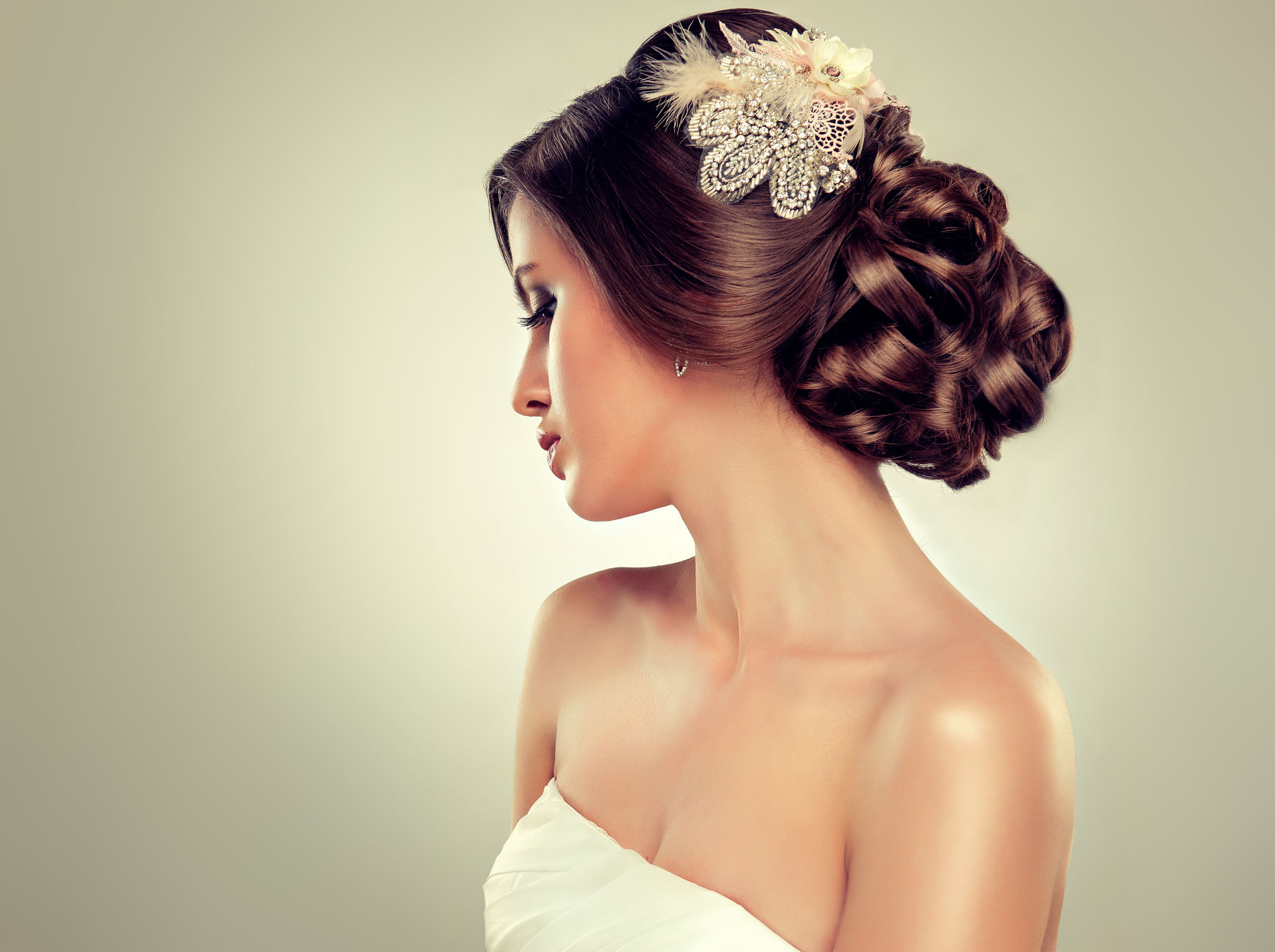 Girl bride  in wedding dress with elegant hairstyle.